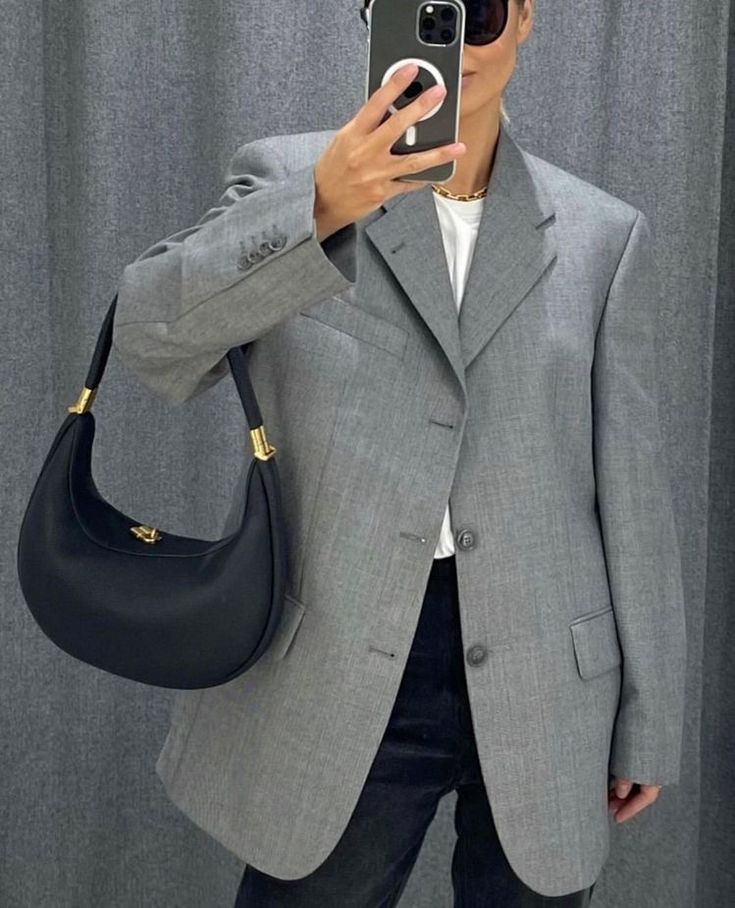 Black crescent convertible handbag with gold-tone chain strap