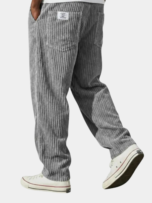 Wide-leg men's trousers with pockets in grey vertical cord texture.
