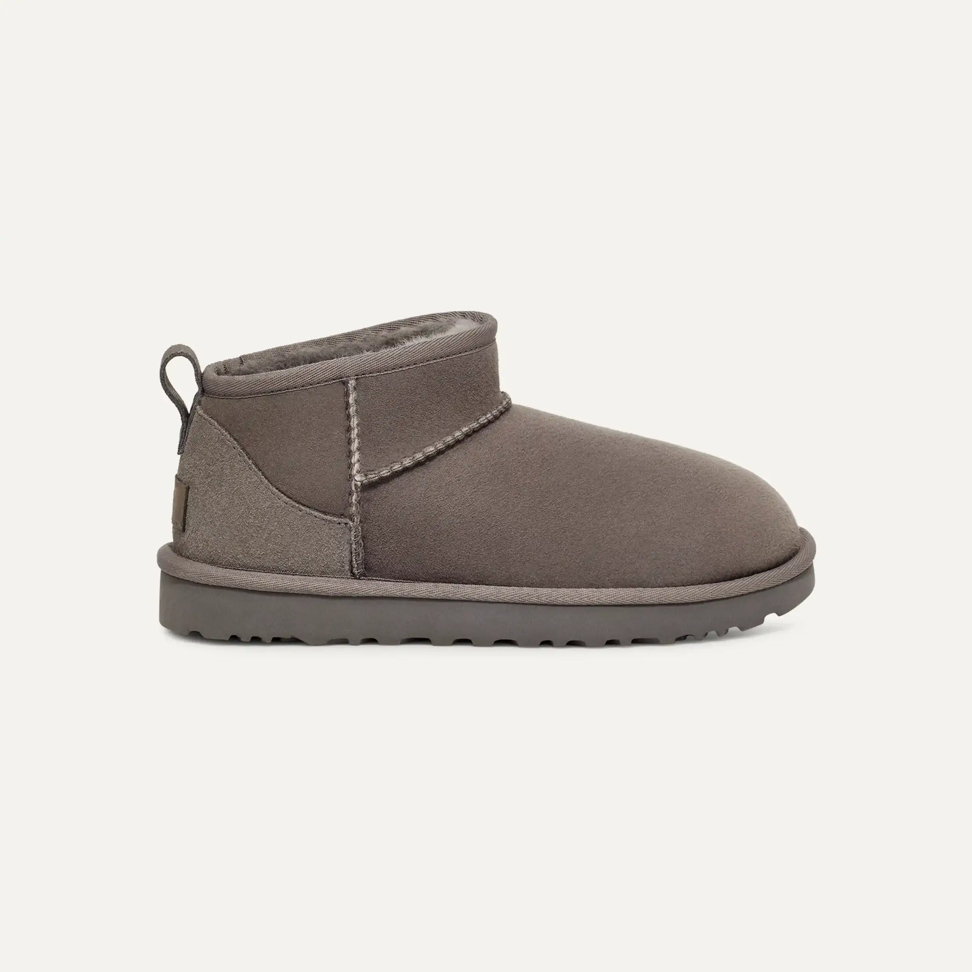 Grey suede ultra mini boots with stitched collar and low rubber sole