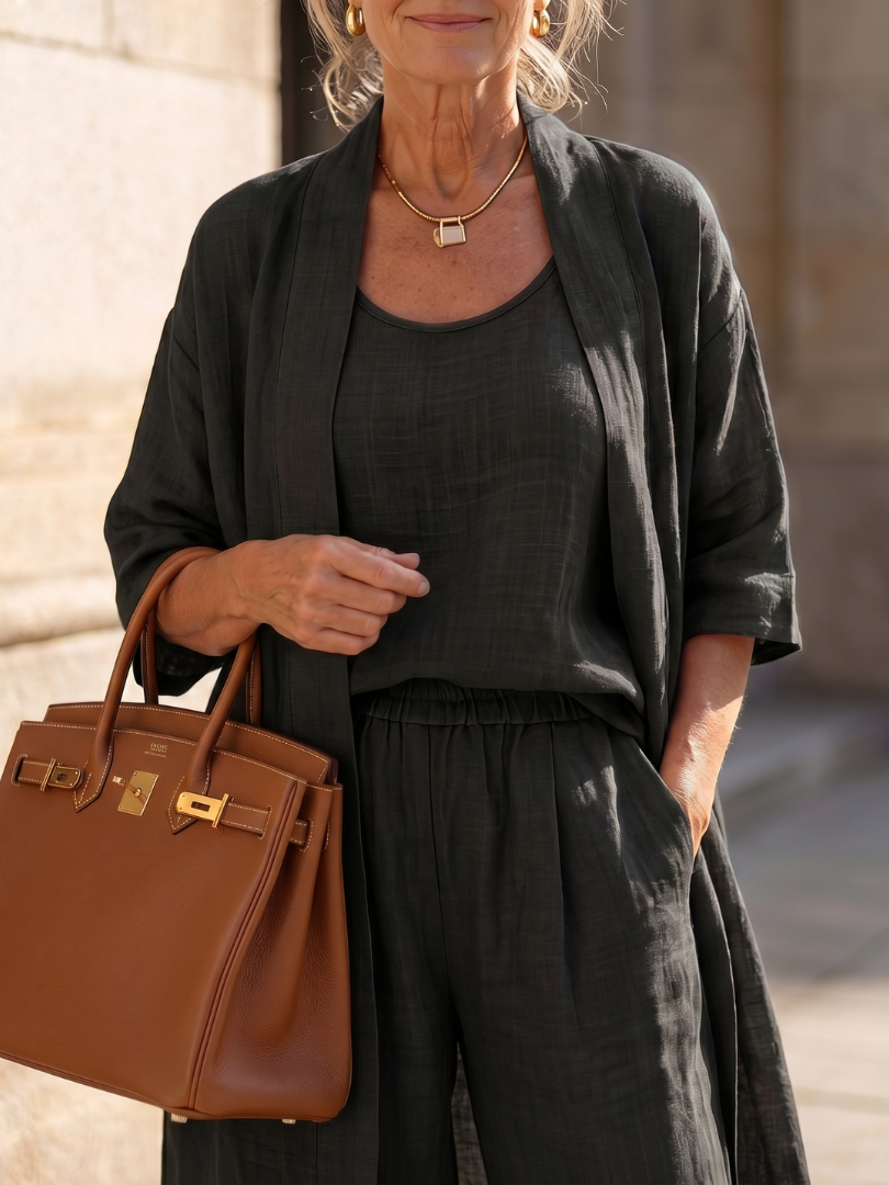 Yael black relaxed top and pant set, close-up with cover-up layer