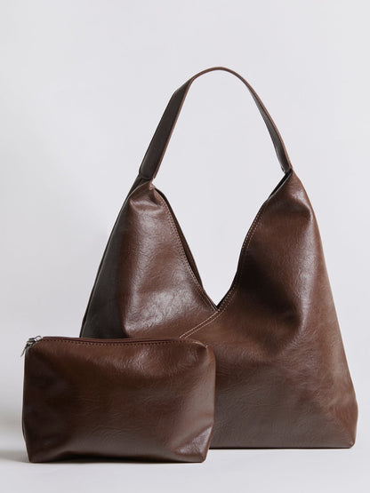 Dark brown leather shoulder bag with matching zip pouch and short top handles.