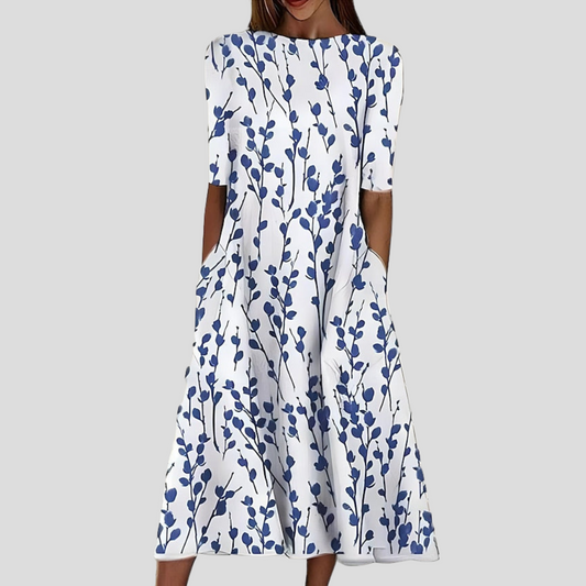Floral midi dress in white with blue sprig print, round neckline and short sleeves