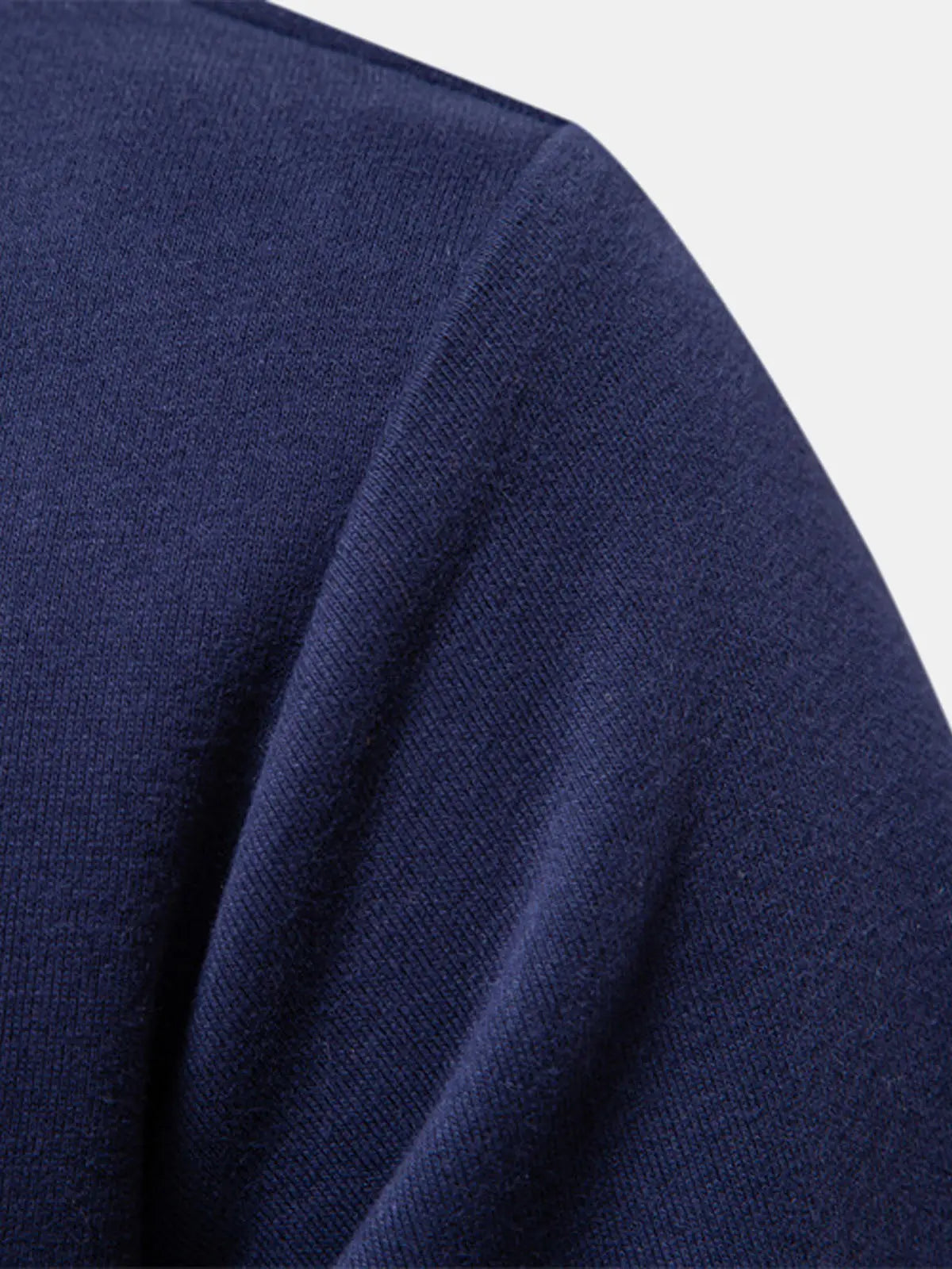 Navy polo sweatshirt fabric close-up with textured knit and seam detail