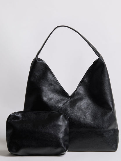 Black leather shoulder bag with short handles and matching zip pouch.