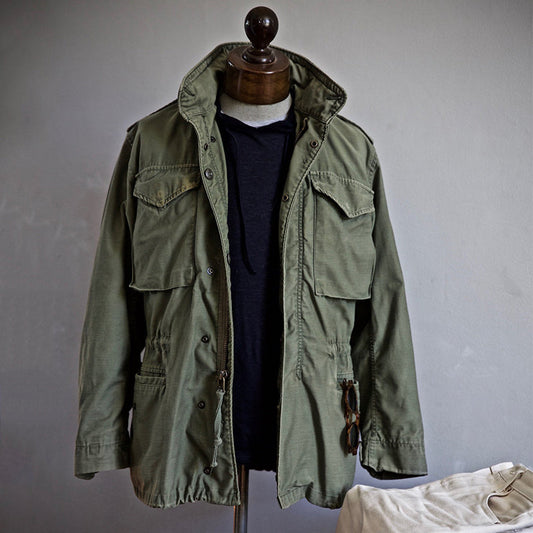 Men's military field jacket, olive green with buttoned front and flap pockets