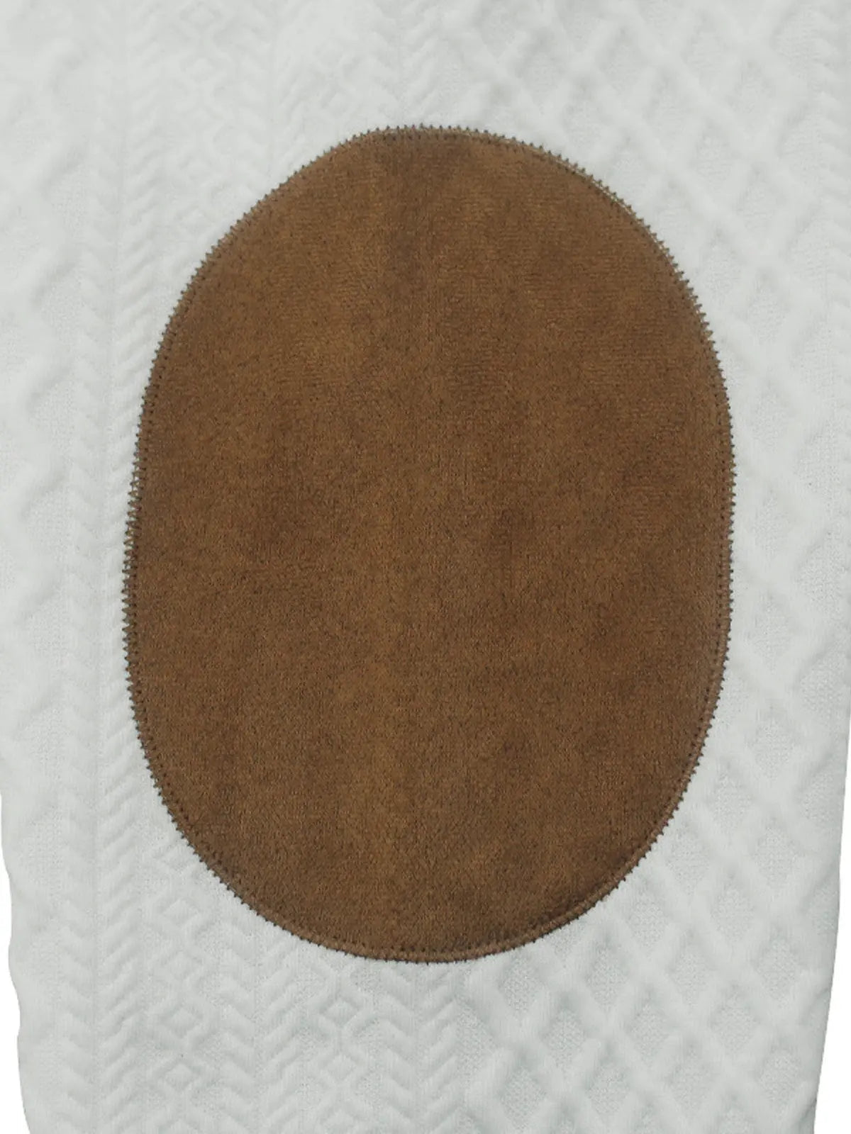 Brown button on a cable knit quarter-button pullover, close-up detail