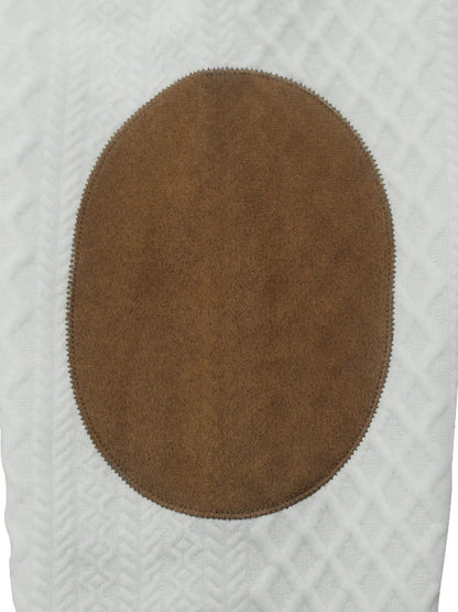 Brown button on a cable knit quarter-button pullover, close-up detail