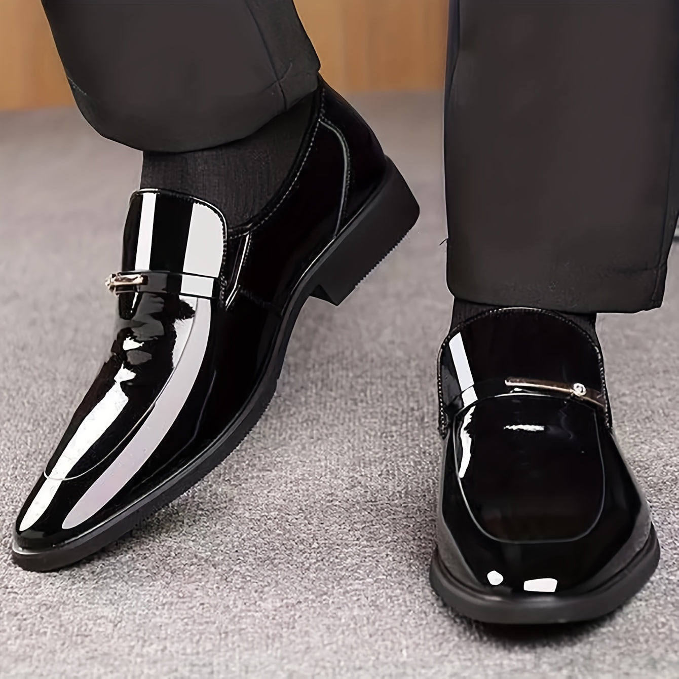 Men's patent penny loafers, pointed toe, black slip-on with metal strap detail