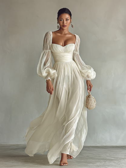 White chiffon maxi dress with square neckline, gathered bodice and long puff sleeves