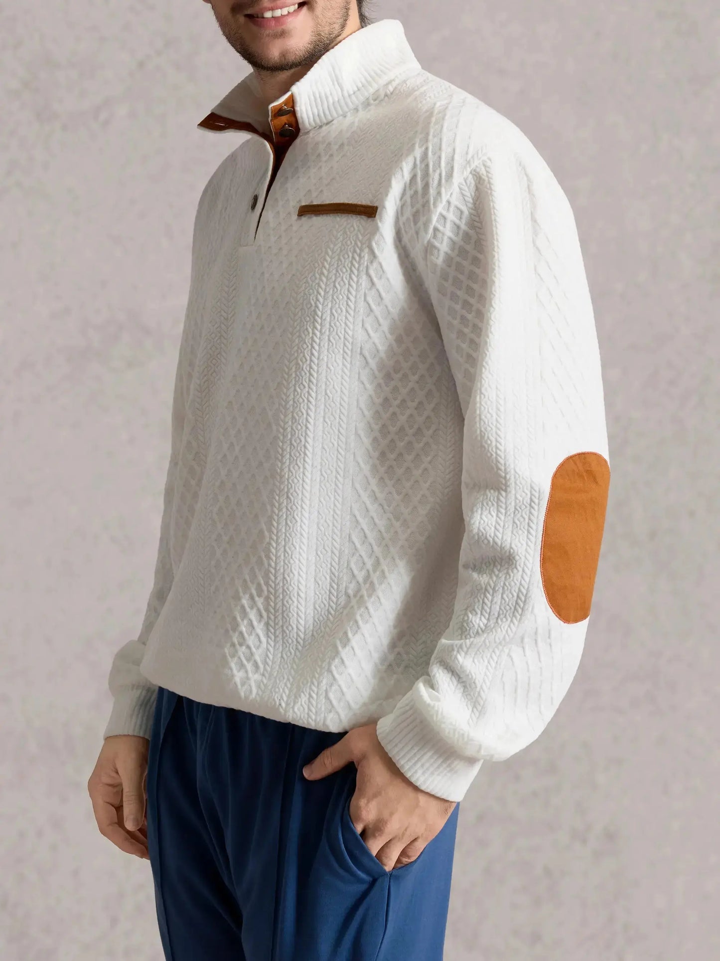 Cable-knit pullover sweatshirt in white with half-button collar and brown accent trim