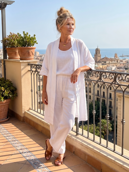 White three-piece relaxed top and pant set with open-front tunic and matching trousers