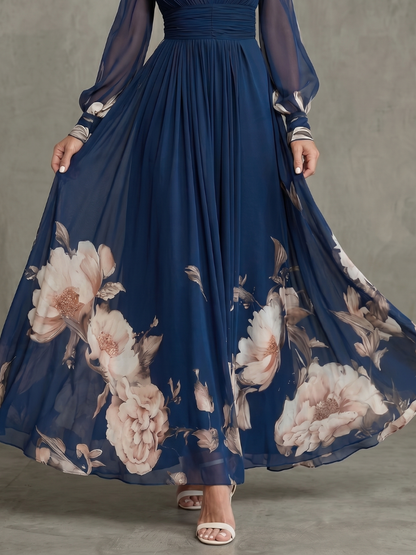 Navy pleated maxi skirt with large floral print hem and sheer sleeve cuffs