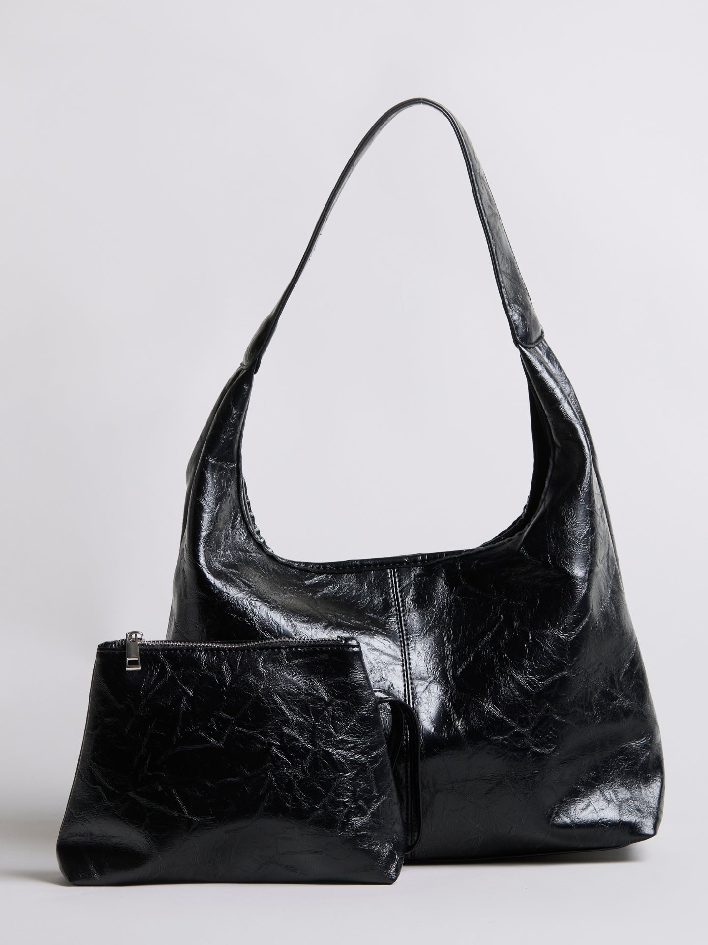 Black distressed vegan leather tote bag with small zip pouch accessory