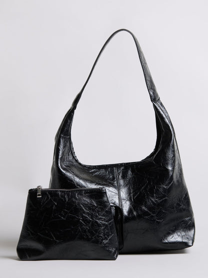 Black distressed vegan leather tote bag with small zip pouch accessory