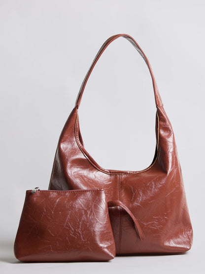 Distressed vegan leather tote bag in rust red with matching zip pouch pocket