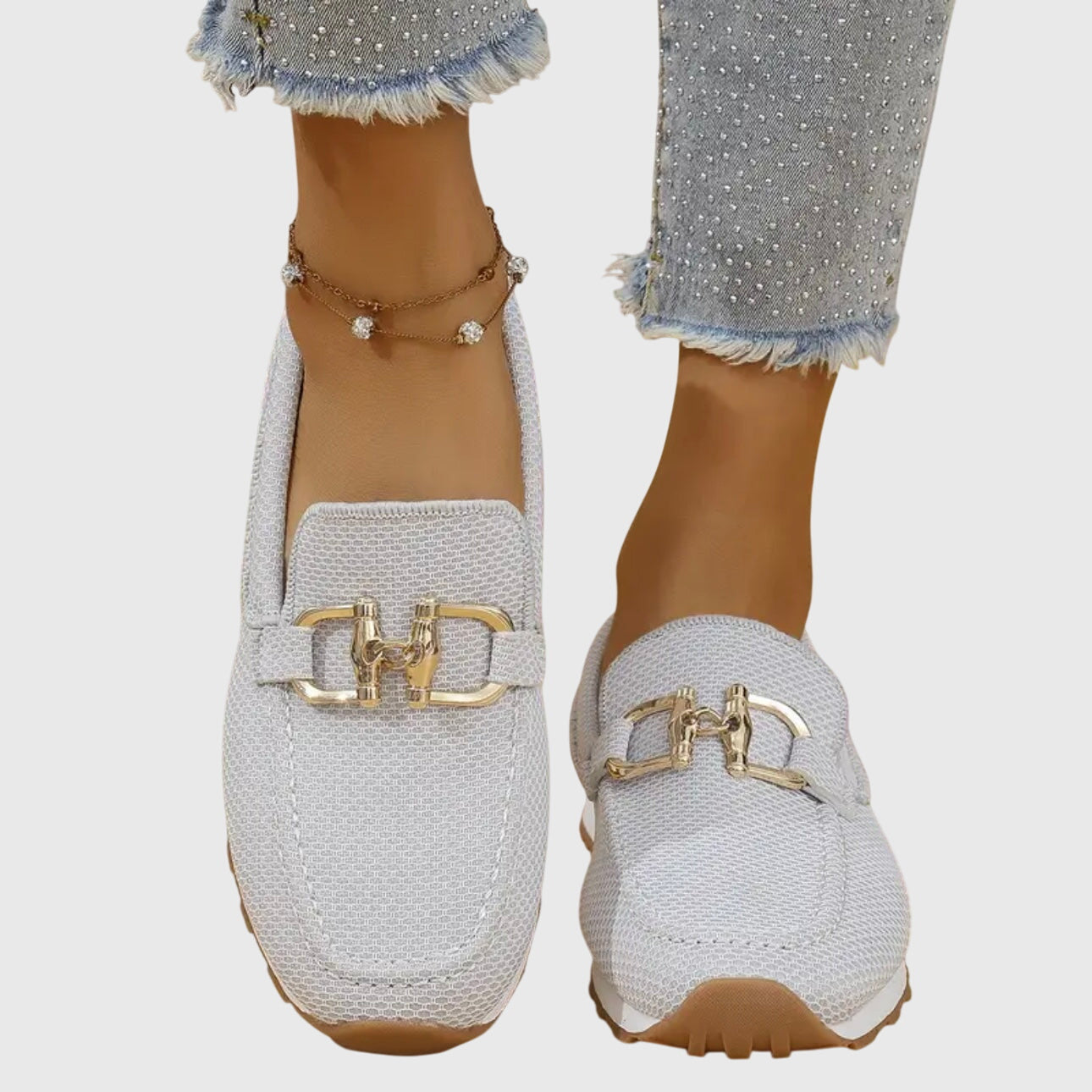 White orthopedic mesh loafers with gold buckle detail and cushioned sole