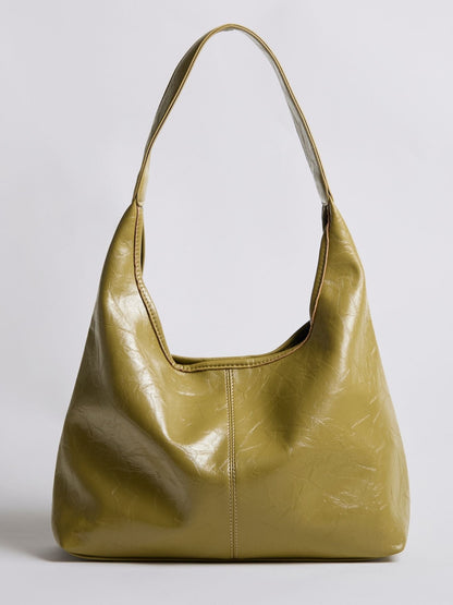 Distressed vegan leather tote bag, gold color with curved shoulder handles