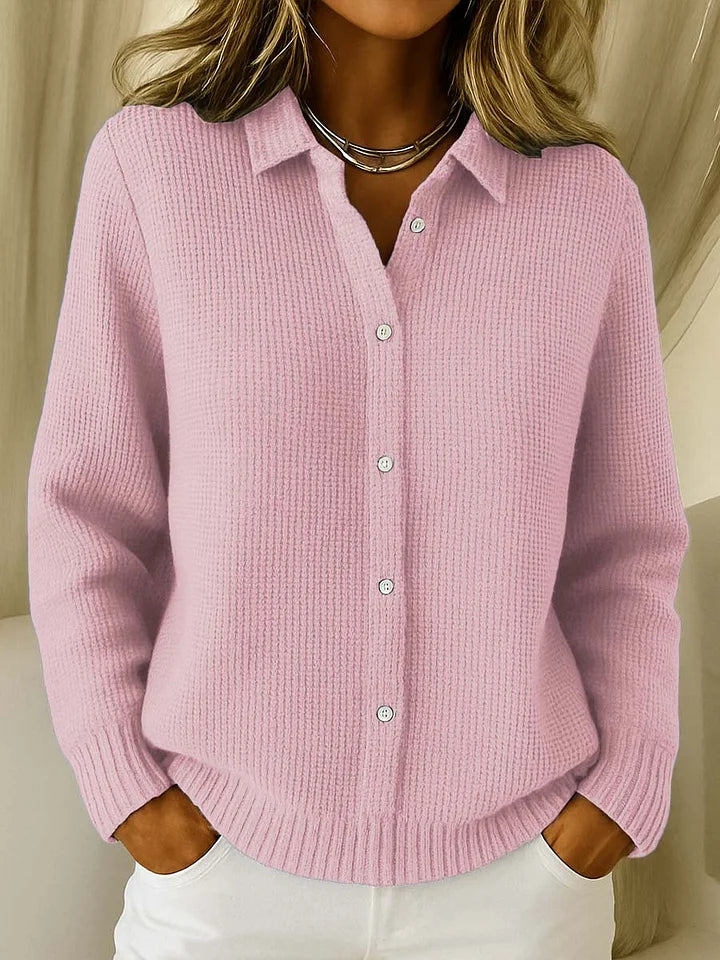 Pink knit cardigan sweater with point collar, button-front, long sleeves, ribbed hem
