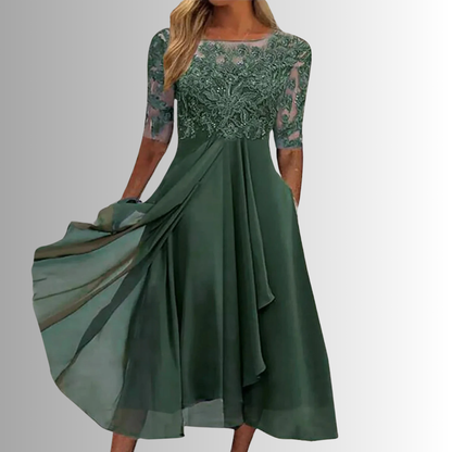 Green lace midi dress with 3/4 sleeves, lace bodice, and layered pleated skirt