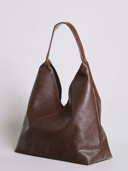 Dark brown leather shoulder bag with textured finish and short top handles.