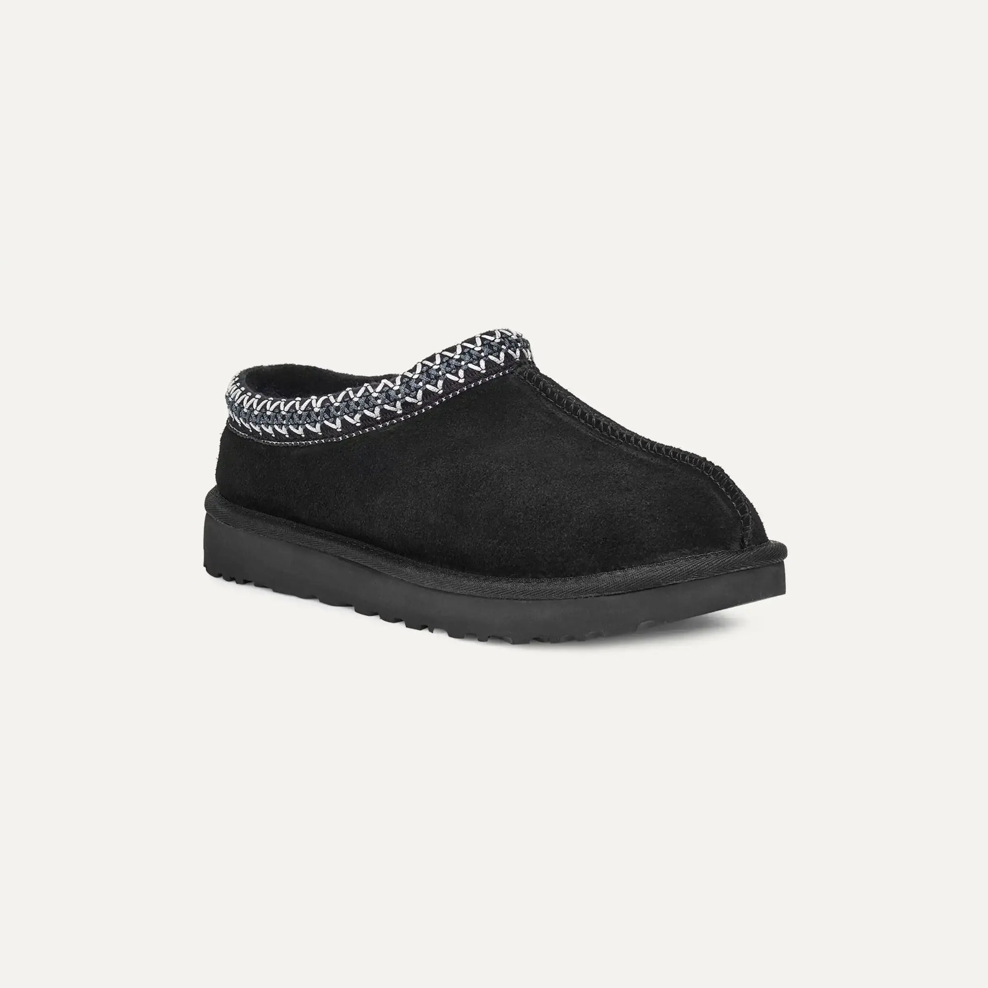 Black suede slip-on slipper with braided collar trim and rubber outsole