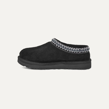 Black suede slipper with moc-style collar and stitched braided trim