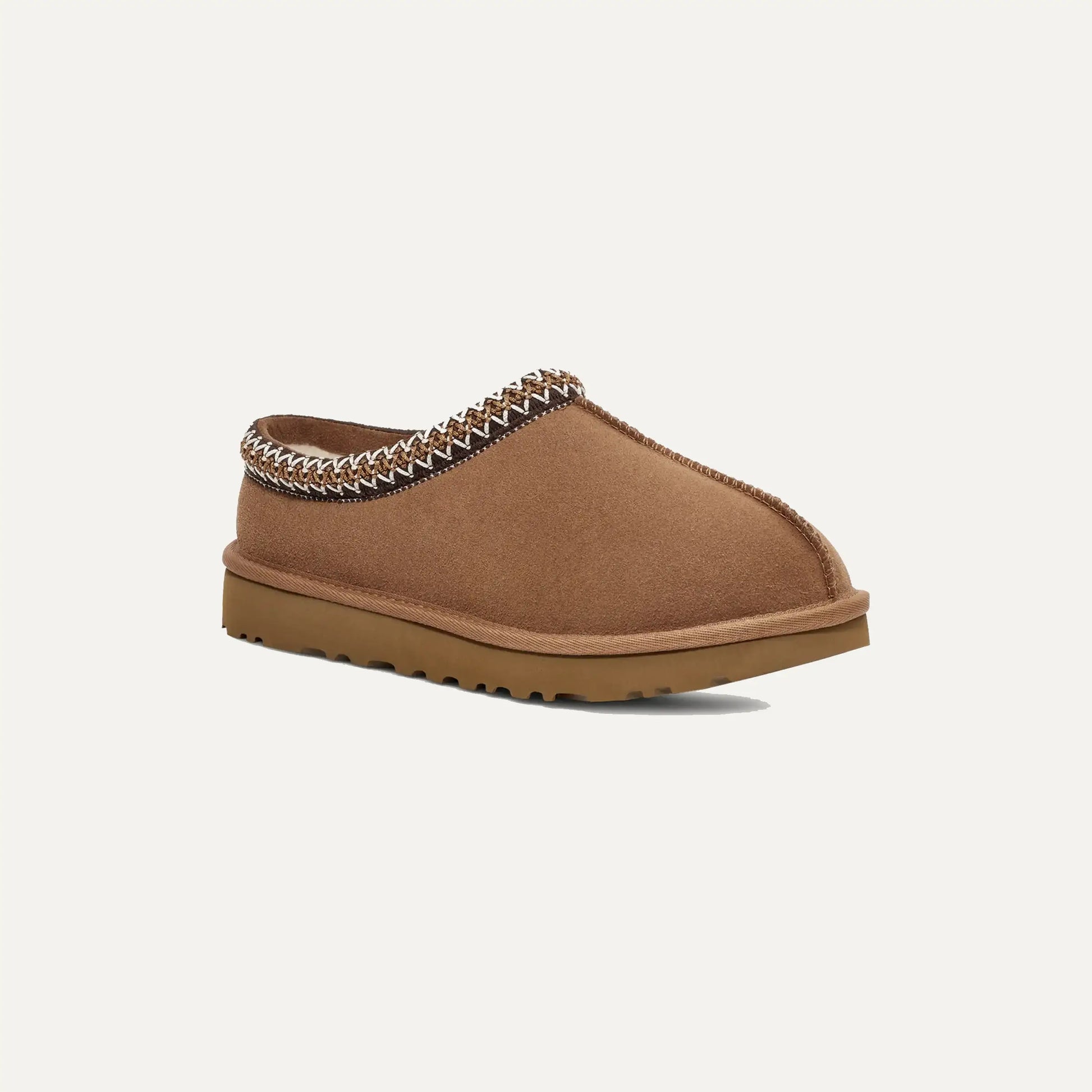 Chestnut brown suede slip-on slipper with braided edge trim and low profile sole