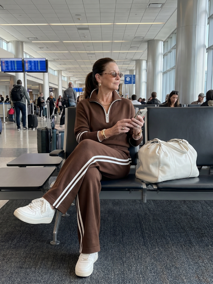 Brown zip-neck long-sleeve and jogger pants set with white trim side stripes