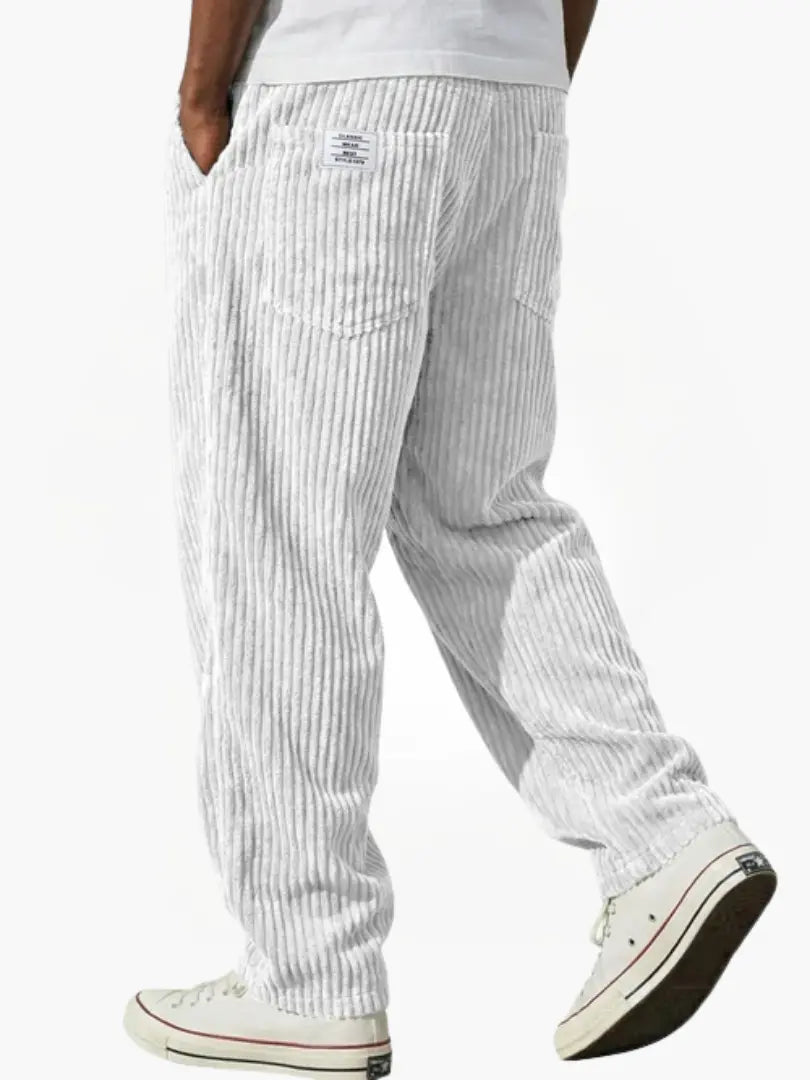 Wide-leg men's trousers with pockets in light grey vertical cord texture.