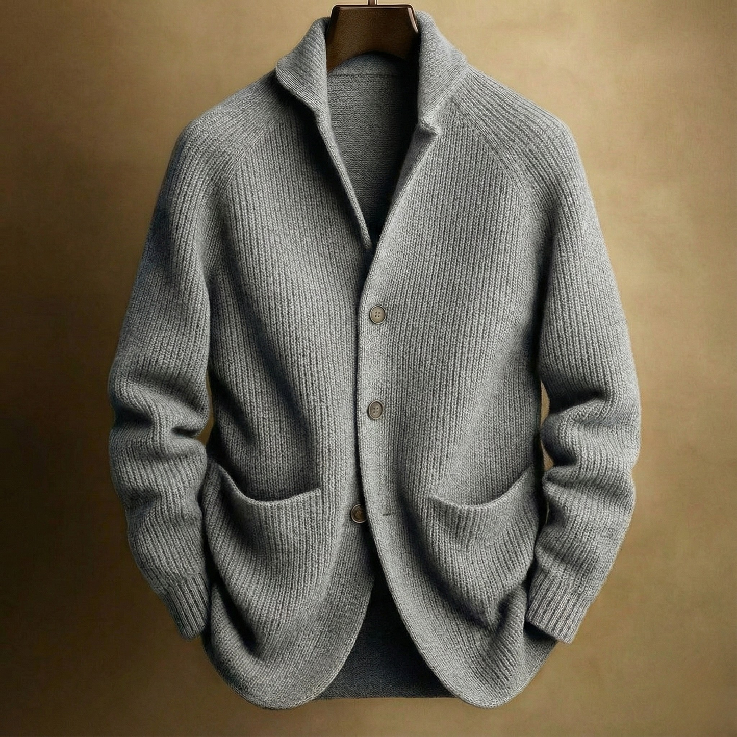 Men's ribbed wool cardigan in heather grey with shawl collar and button front, two pockets.