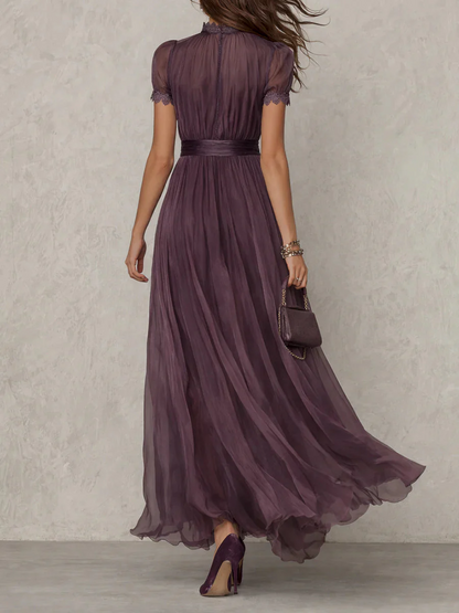 Women's plum maxi dress with puff sleeves and pleated skirt (back view)