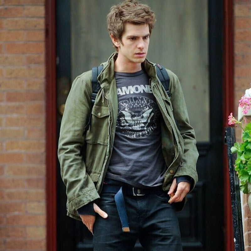 Men's olive green field jacket with flap chest pockets, worn open over T-shirt