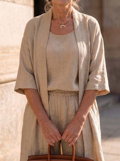 Beige relaxed top and wide-leg pants set with open kimono layer, front close-up