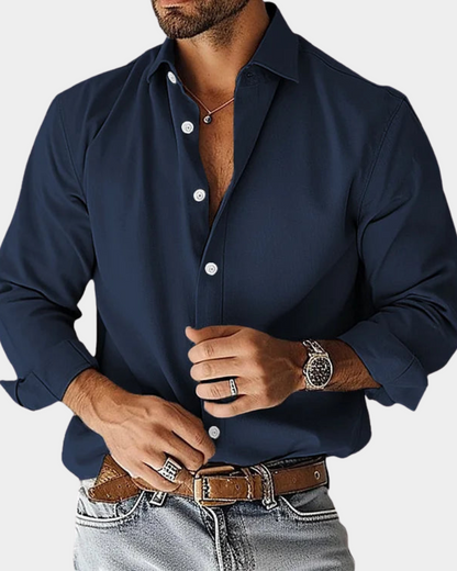 Navy long-sleeve button-up shirt with pointed collar and button front