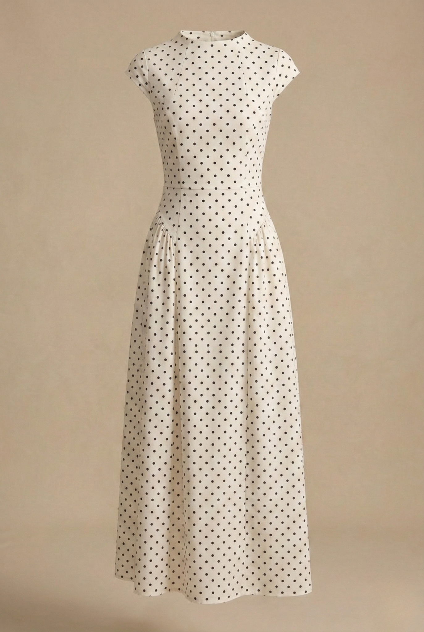 White polka dot maxi dress with high neckline, cap sleeves, and pleated skirt