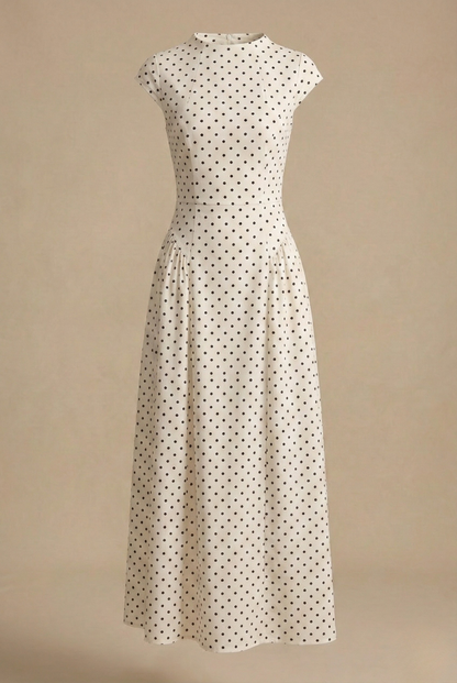 White polka dot maxi dress with high neckline, cap sleeves, and pleated skirt