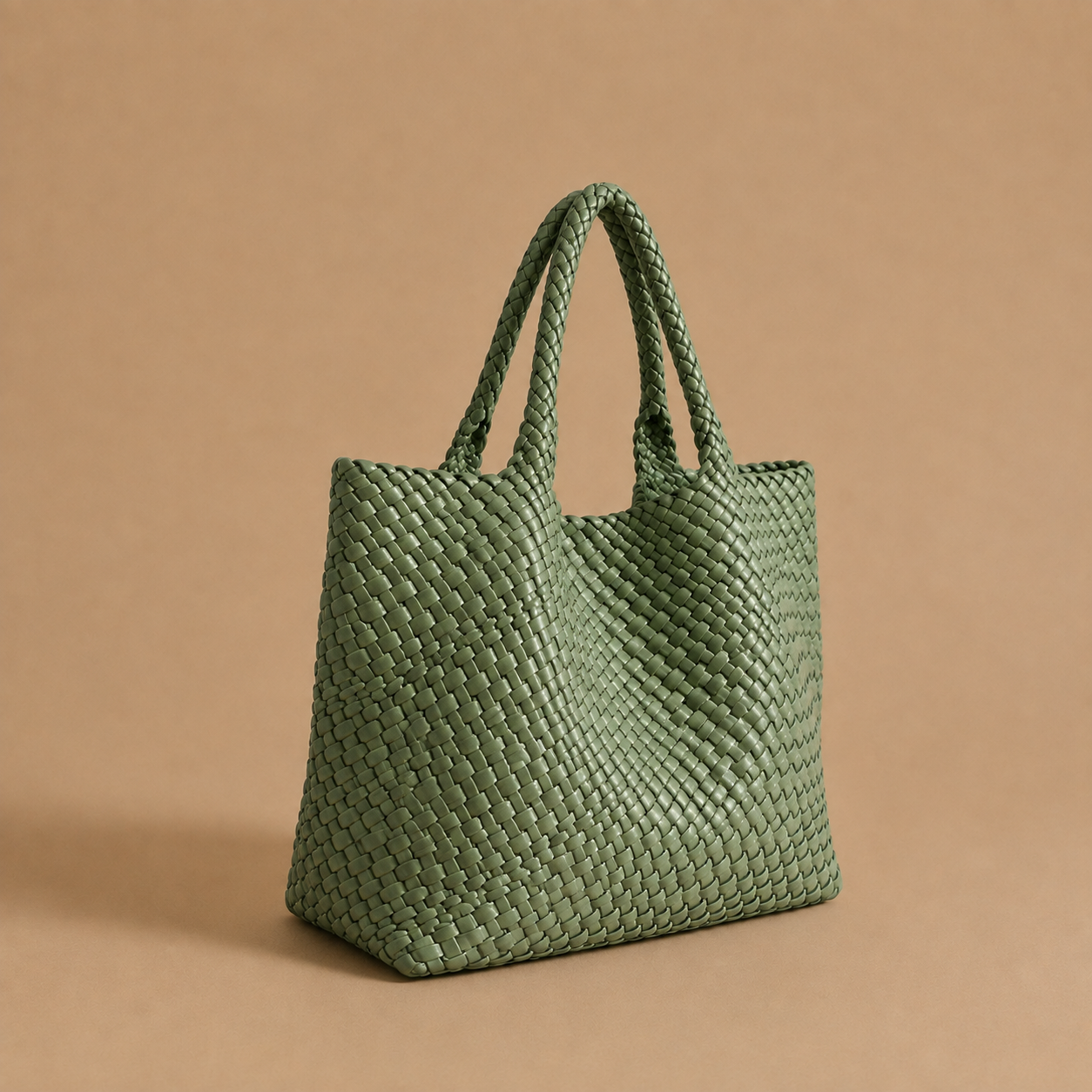 Womens woven tote bag with top handles, light green woven texture.