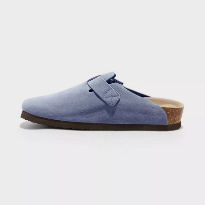 Light blue suede clog side view with adjustable buckle strap and textured sole