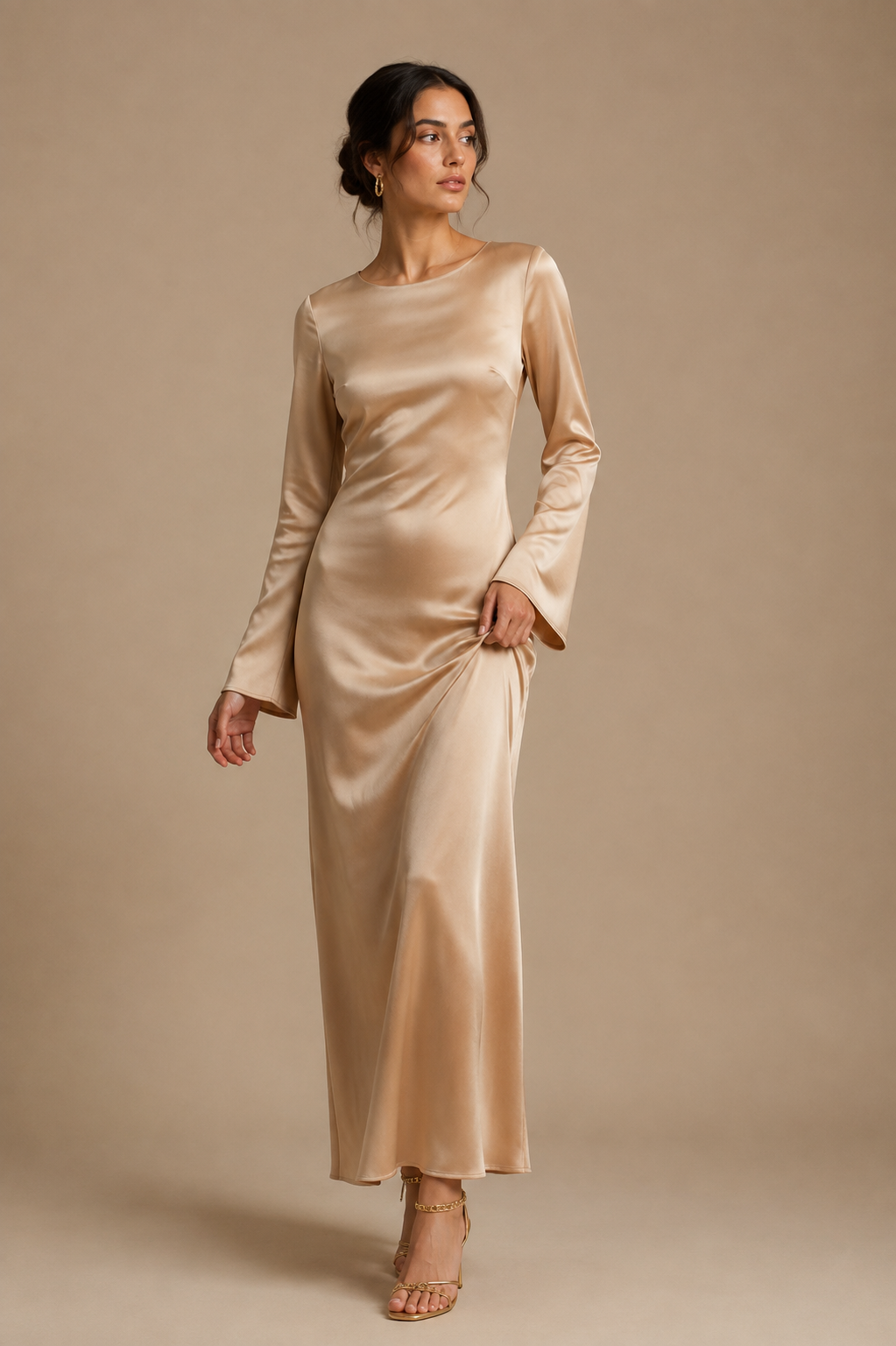 Champagne satin maxi dress with long sleeves and gathered waist ruching