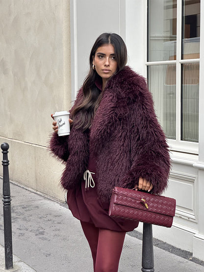Burgundy woven vegan leather clutch with gold clasp and top handle