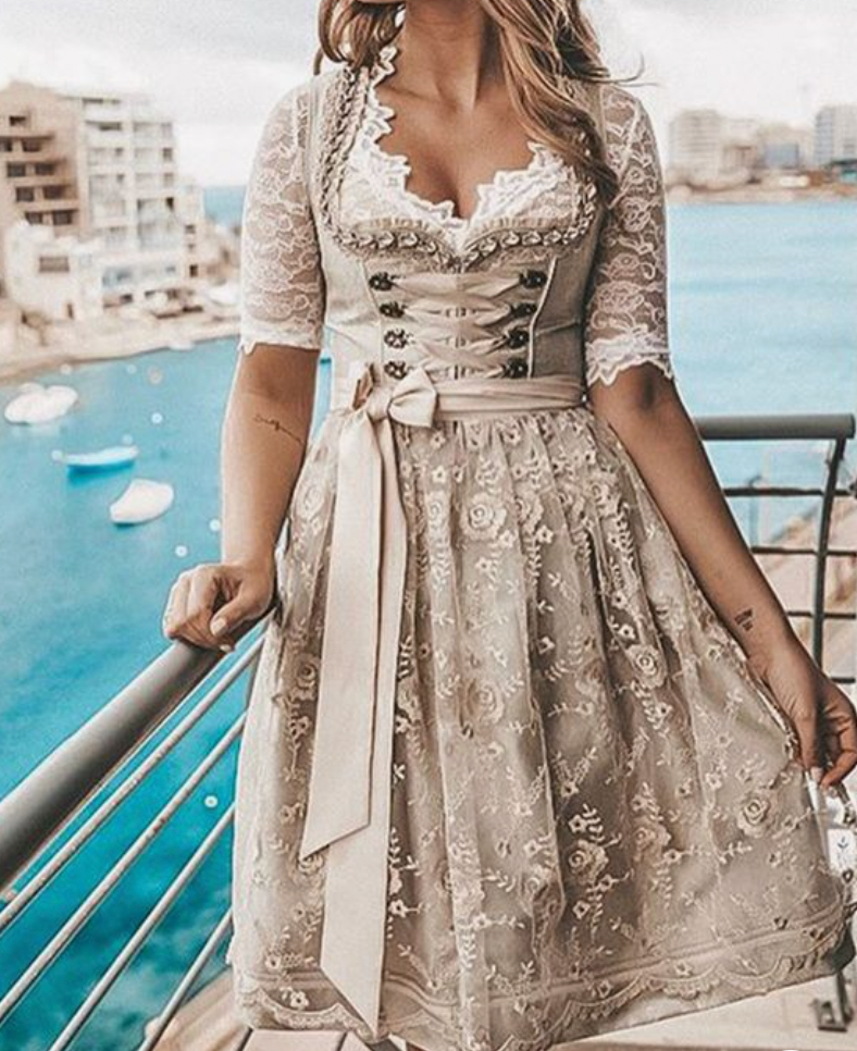 Beige Oktoberfest dirndl dress with lace short-sleeve blouse, corset bodice and bow tie