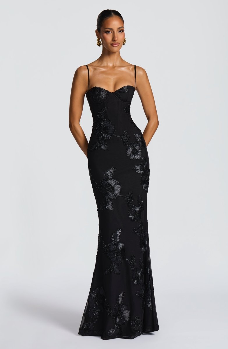 Black strapless lace maxi dress with floral lace pattern, fitted silhouette.