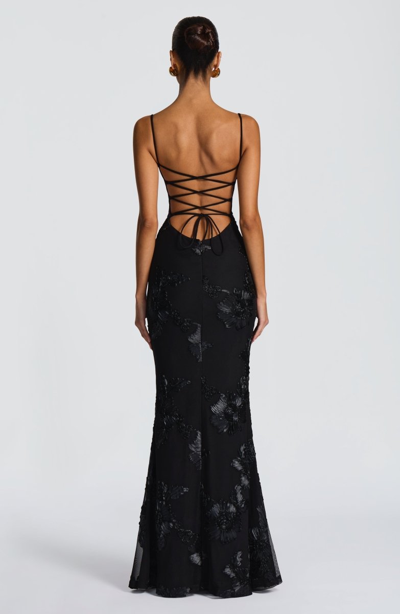 Black lace maxi dress with open back crisscross tie straps, fitted mermaid style.