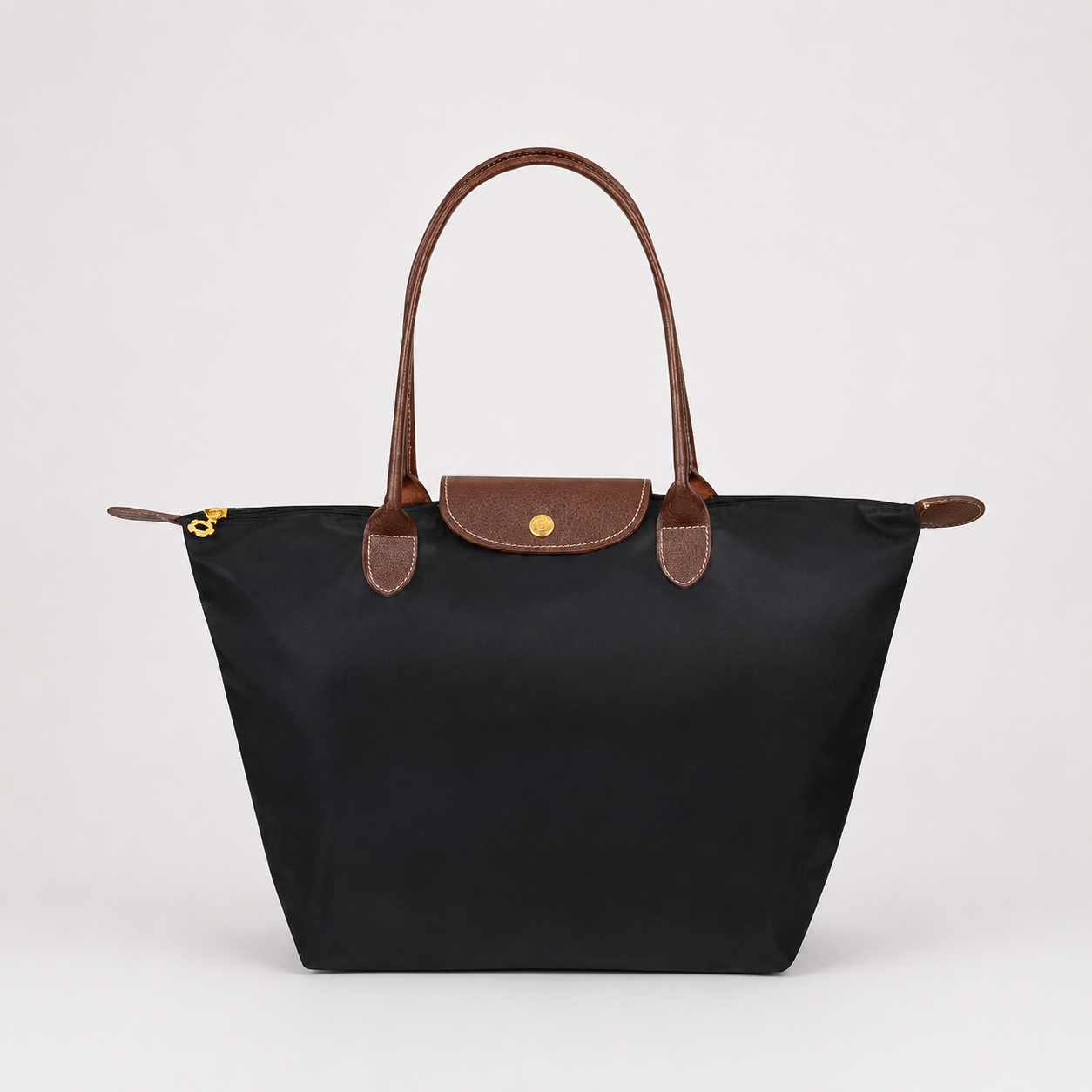 Structured shoulder tote bag with top handles, front flap, and gold clasp, dark black
