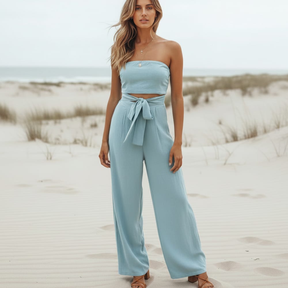 Blue strapless wide-leg jumpsuit with bow-tie waist and wide pant legs