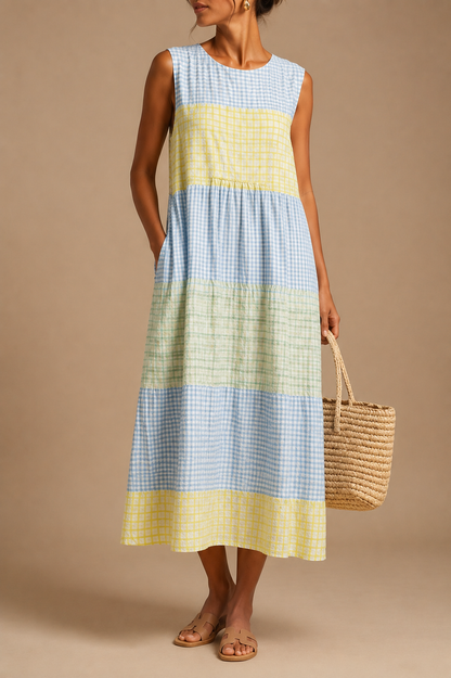 Sleeveless knee-length dress in blue and yellow check stripe pattern