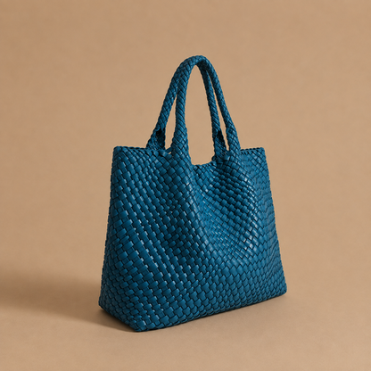 Womens woven tote bag with top handles, blue woven texture.