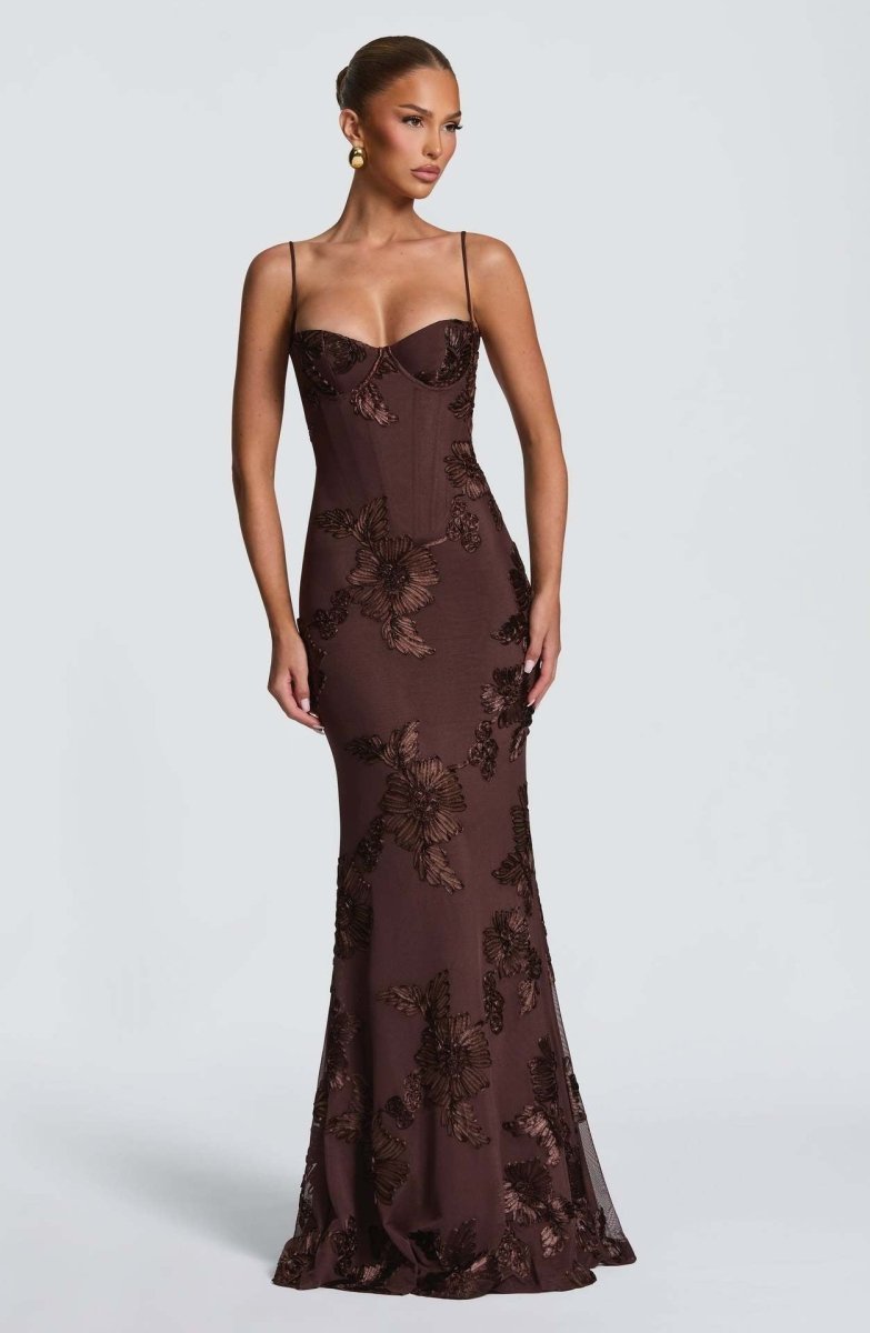 Brown lace maxi dress with spaghetti straps and fitted floral pattern.