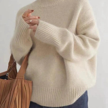 Beige cashmere roll-neck jumper close-up, chunky knit and ribbed cuffs