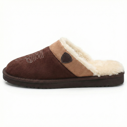 Cowboy slippers in dark brown suede with tan strap panel, plush white lining, cushioned sole.
